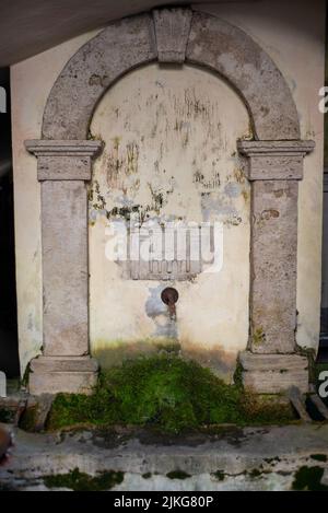 An ancient public water fountain in Orte, Italy Stock Photo