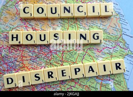 SocialHousing / Council Housing Disrepair problems with responsive repairs spelled out in Scrabble letters on a map of northern England & Midlands Stock Photo