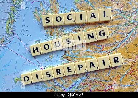Scotland SocialHousing / Council Housing Disrepair problems with responsive repairs spelled out in Scrabble letters on a map Stock Photo