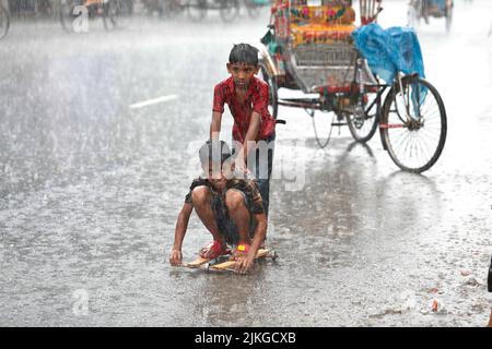 Dhaka, Bangladesh - August 02, 2022: People walk through the Mugda para ...