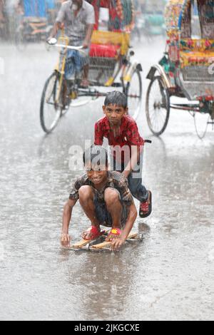 Dhaka, Bangladesh - August 02, 2022: People walk through the Mugda para ...