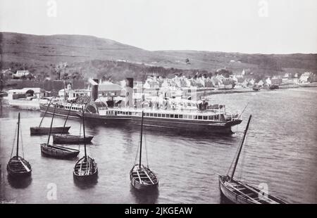 Ardrishaig, Loch Gilp, Argyll and Bute, west of Scotland.  The steamer Columba at Ardrishaig Quay, seen here in the 19th century.  From Around The Coast,  An Album of Pictures from Photographs of the Chief Seaside Places of Interest in Great Britain and Ireland published London, 1895, by George Newnes Limited. Stock Photo