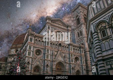 View of Cathedral of Santa Maria del Fiore by night with christmas tree in Florence during starry night Stock Photo