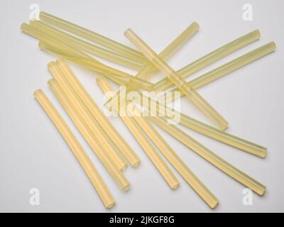 selection of  Hot Glue Gun   rods  sticks on a white background Stock Photo