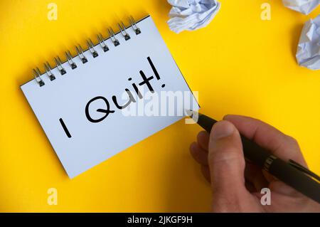 I quit text on white notepad on yellow cover background. Employment and resignation Stock Photo