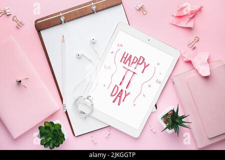 Tablet computer with stationery on pink background. Happy Pi Day Stock Photo
