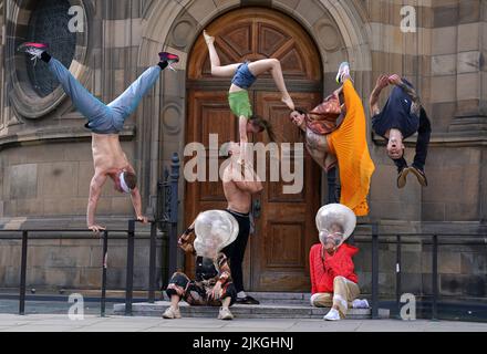 Circus artists from the Ukraine and Czech Repulic perform during a photocall for Boom! outside McEwan Hall, Edinburgh, to promote their upcoming appearances at the Underbelly Bristo Square throughout the Edinburgh Festival Fringe. Boom! is a collaboration between Cirk La Putyka and Kyiv Municipal Academy of Variety and Circus Art. Picture date: Tuesday August 2, 2022. Stock Photo
