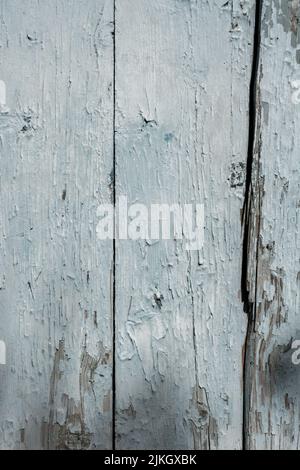A vertical closeup shot of old blue weathered wooden wall texture Stock Photo