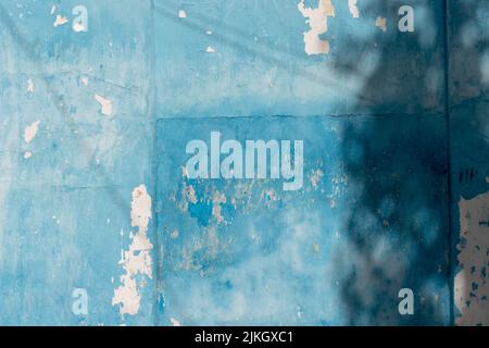 A closeup shot of an old blue weathered wooden wall texture Stock Photo