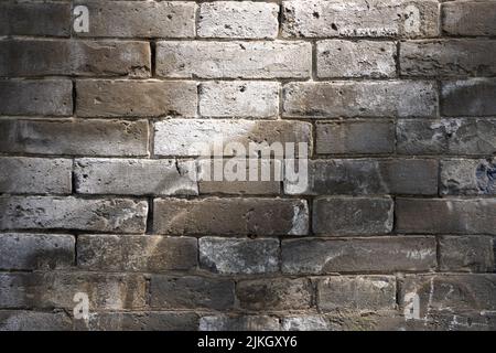 A closeup shot of a brick wall textured background Stock Photo
