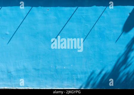 A blue wall with shadows Stock Photo