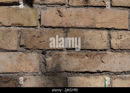 A closeup shot of an old weathered brick wall texture Stock Photo