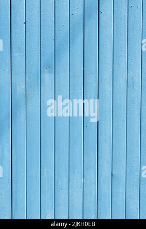 A vertical shot of blue painted metal gate background Stock Photo