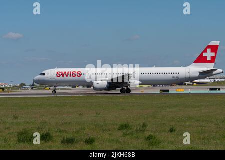 An Airbus A321-111 plane of the Swiss airline ready to take off on the runway at Lisbon airport Stock Photo