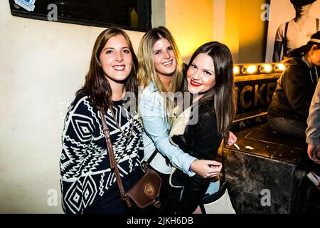 Johannesburg, South Africa - April 24, 2014: Trendy young people attending a outdoor party event Stock Photo