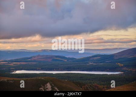 a beautiful view of a mountain river under overcast sky at sunset in Scotland Stock Photo
