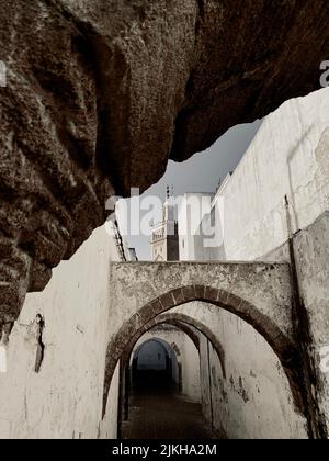 A vertical shot of a narrow alley between the brick buildings Stock ...
