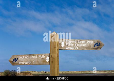 Signpost showing the England Coast Path between Amble and Warkworth in Northumberland, UK Stock Photo