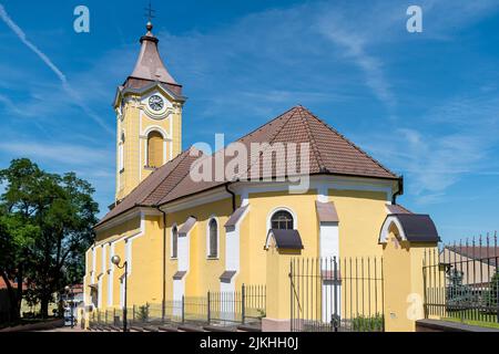 Holic, Slovakia - June 18, 2022 The Church of the Divine Heart stands from behind Stock Photo