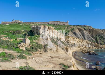 Panoramic view of hills and Fort Chambray, in Gozo, Malta, fortress built by Order of St John to protect the coastline at Xatt l-Ahmar, Ghajnsielem Stock Photo