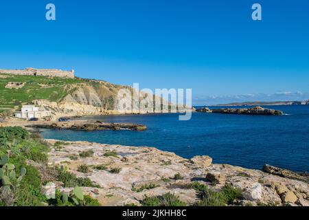 Panoramic view of hills and Fort Chambray, in Gozo, Malta, fortress built by Order of St John to protect the coastline at Xatt l-Ahmar, Ghajnsielem Stock Photo