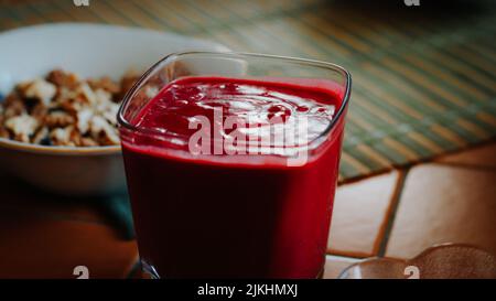 A glass of red smoothie from fresh fruits Stock Photo