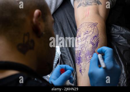 Artist Tattooing Womans Shoulder High-Res Stock Photo - Getty Images
