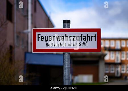 A sign for fire engine entrance against a blurred background in Bremen, Germany Stock Photo