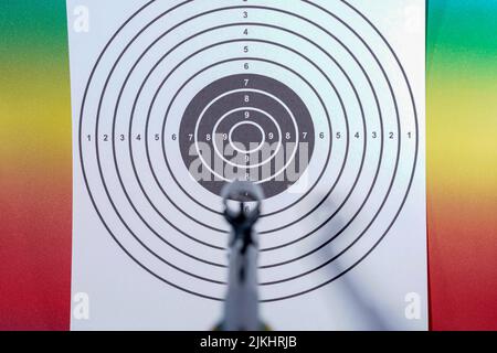 A target on white paper on a colorful background Stock Photo