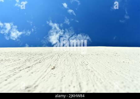 a shot of white concrete wall agaisnt blue sky Stock Photo