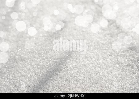A white snow texture background with blurred bokeh circles above Stock Photo
