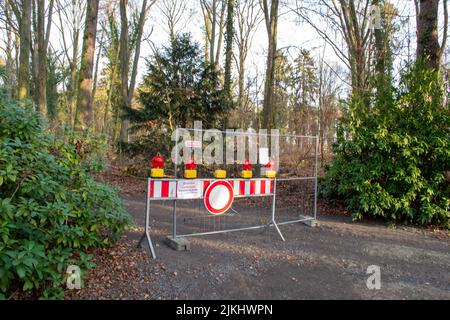 A closed park with stop symbols after a storm. Germany Stock Photo