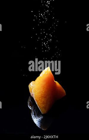 A closeup shot of cooked Zongzi traditional Chinese rice-pudding isolated with black background Stock Photo