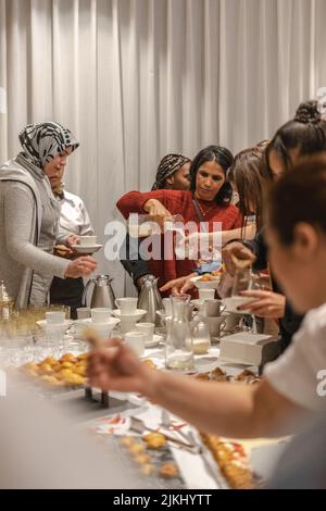 Group of women celebrating Women's day together indoors Stock Photo