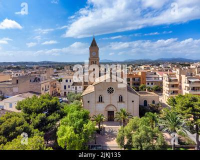 Spain, Balearic islands, Mallorca, district of Manacor, Portocristo. Aerial view of the city and the main church of Santa Maria de Portocristo Stock Photo