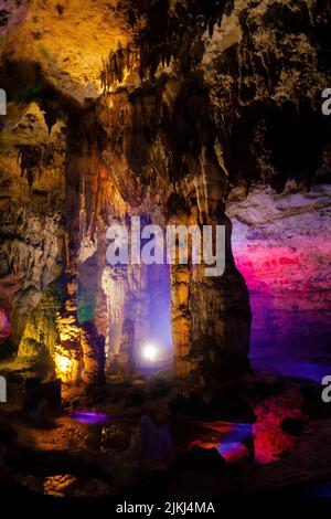 A scenic inside view of the Shuanghedong Caves with colorful lights, Wenquan, Suiyang County, Guizhou Province, China Stock Photo