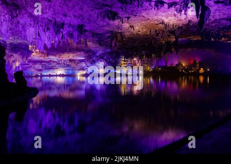 A scenic inside view of the Shuanghedong Caves with colorful lights, Wenquan, Suiyang County, Guizhou Province, China Stock Photo