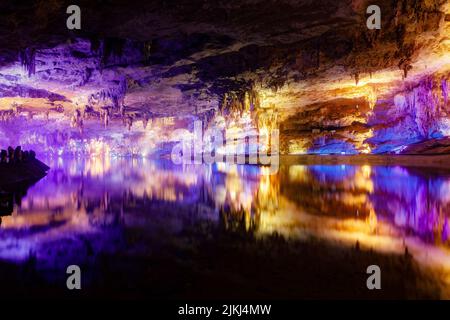 A scenic inside view of the Shuanghedong Caves with colorful lights, Wenquan, Suiyang County, Guizhou Province, China Stock Photo