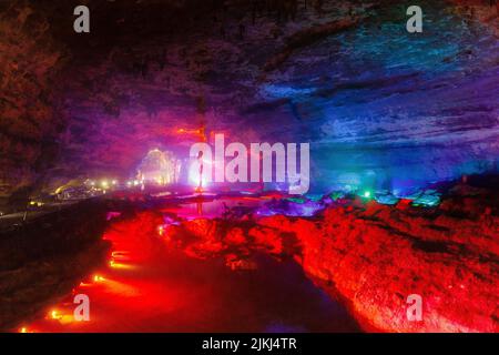 A scenic inside view of the Shuanghedong Caves with colorful lights, Wenquan, Suiyang County, Guizhou Province, China Stock Photo