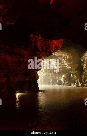 A scenic inside view of the Shuanghedong Caves with colorful lights, Wenquan, Suiyang County, Guizhou Province, China Stock Photo