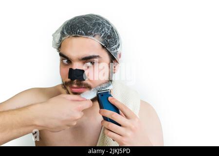 Middle Eastern Man Shaving With Electric Razor Stock Photo - Alamy