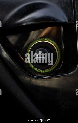 Vertical Close up of the car cigarette lighter socket.modern car interior: parts, buttons, knobs.. Stock Photo