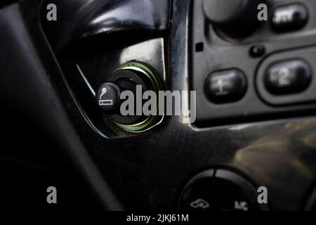 .Close up of the car cigarette lighter socket.modern car interior: parts, buttons, knobs.. Stock Photo