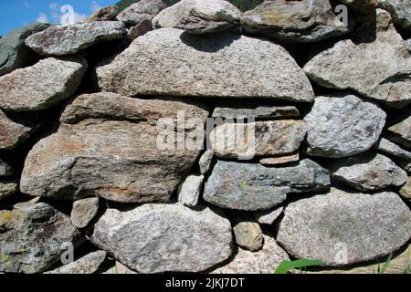 Stone wall in Prettau, Ahrntal, Province of Bolzano, South Tyrol, Italy Stock Photo