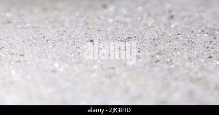 Shiny glittering white tiny sparkles textured background Stock Photo