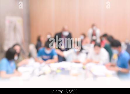 Table Top Background on blurred people lecture in seminar room education or meetting concept ,abstract blur people background Stock Photo