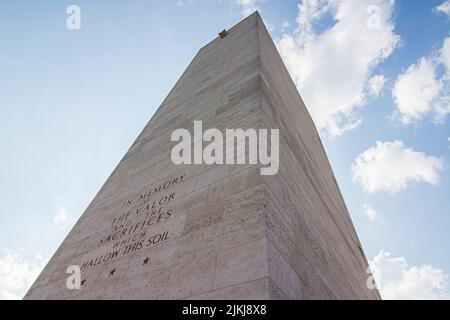 A low angle shot of a memorial tower in the American military cemetery Stock Photo