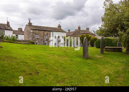 Dent, Cumbria, England, UK - 12 August 2018: Cemetery at the Saint Andrew Church, active Anglican parish church. The church contains Norman architectu Stock Photo