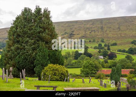 Dent, Cumbria, England, UK - 12 August 2018: Cemetery at the Saint Andrew Church, active Anglican parish church. The church contains Norman architectu Stock Photo