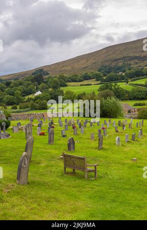 Dent, Cumbria, England, UK - 12 August 2018: Cemetery at the Saint Andrew Church, active Anglican parish church. The church contains Norman architectu Stock Photo